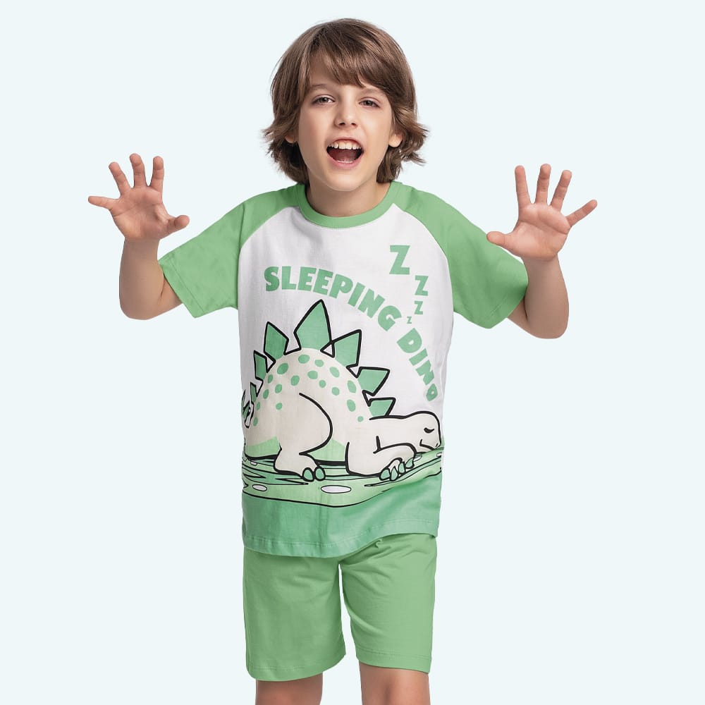 Pijama Dino verde brilla en la oscuridad